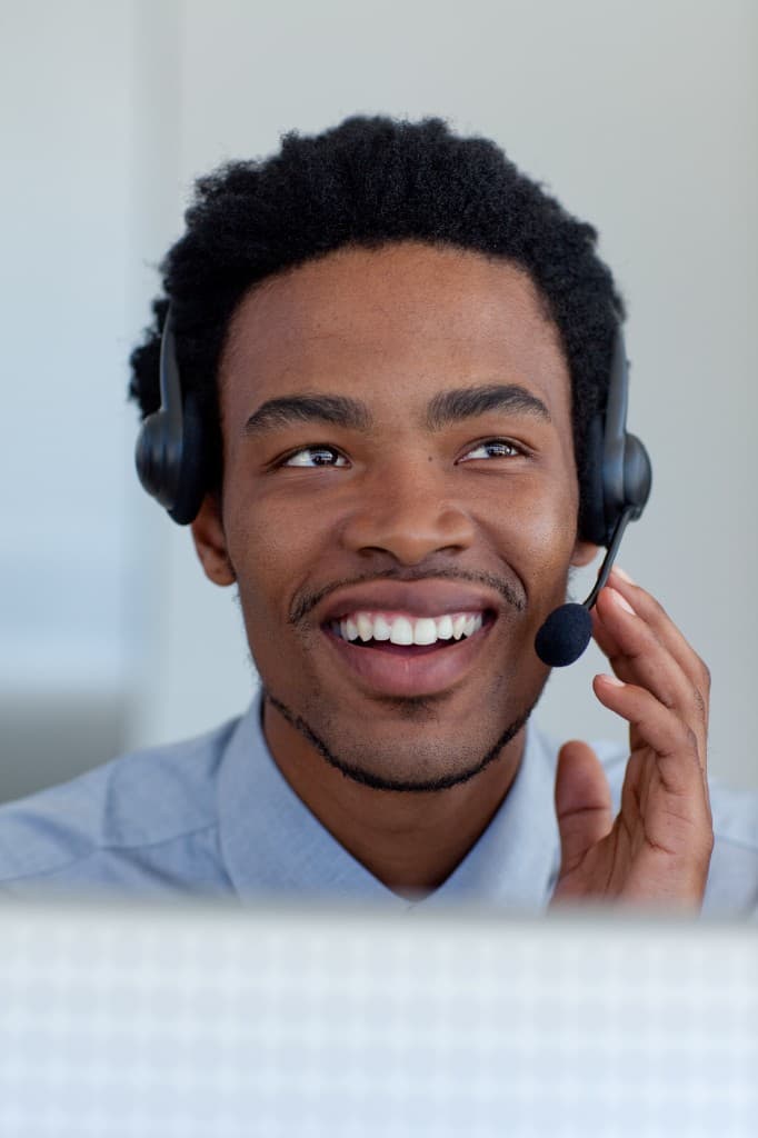 BizFunding support agent wearing a headset, ready to help Nigerian business owners